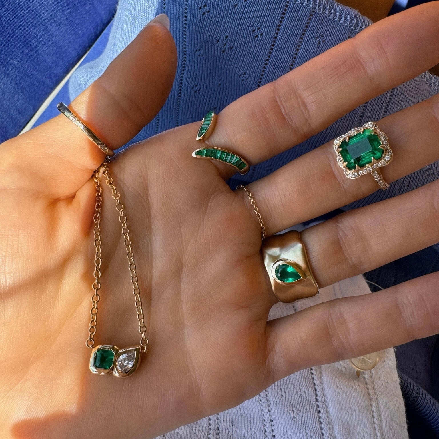 Queen Emerald Cut Emerald Ring with Full Pavé Diamond Halo by Logan Hollowell Jewelry